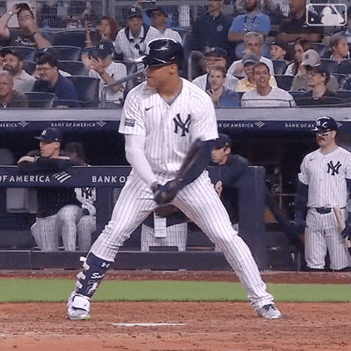 a new york yankees baseball player is getting ready to bat