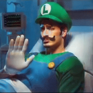 a man in a hospital bed dressed as luigi with a l on his hat