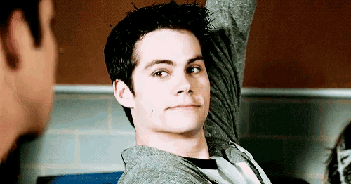 a close up of a young man with his arm up
