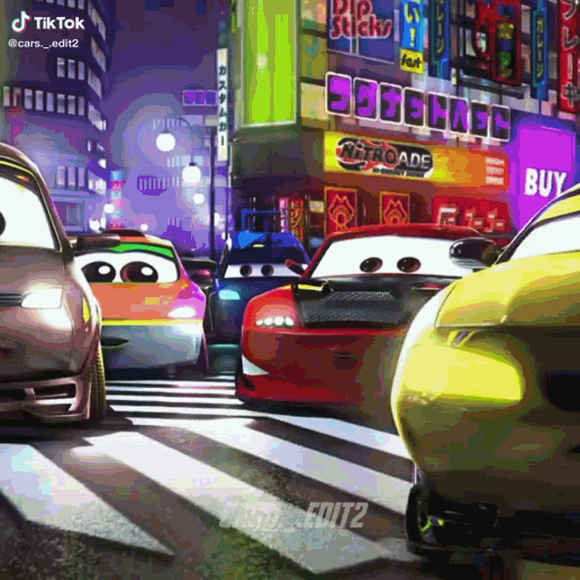 cars are driving down a street in front of a store that says nitroade