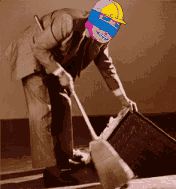 a man in a suit is sweeping the floor with a broom