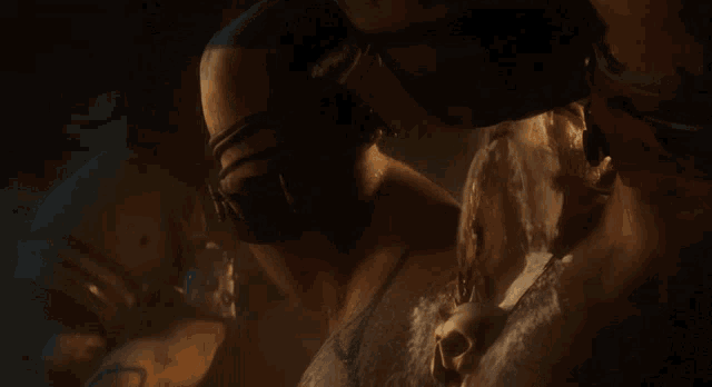 a man with a tattoo on his arm is wearing headphones and a mask