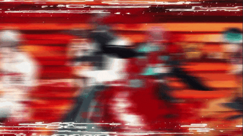 a blurry picture of a person in a red and orange background