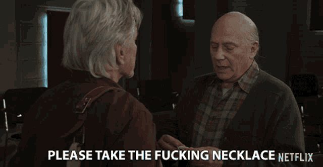 two older men are talking to each other and one of them says please take the fucking necklace
