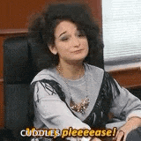 a woman is sitting in a chair and saying `` cuddles pleeease '' .