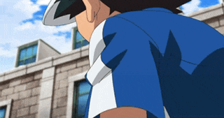 a man in a blue shirt is standing in front of a white building