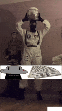 a man in a space suit holds a helmet over his head