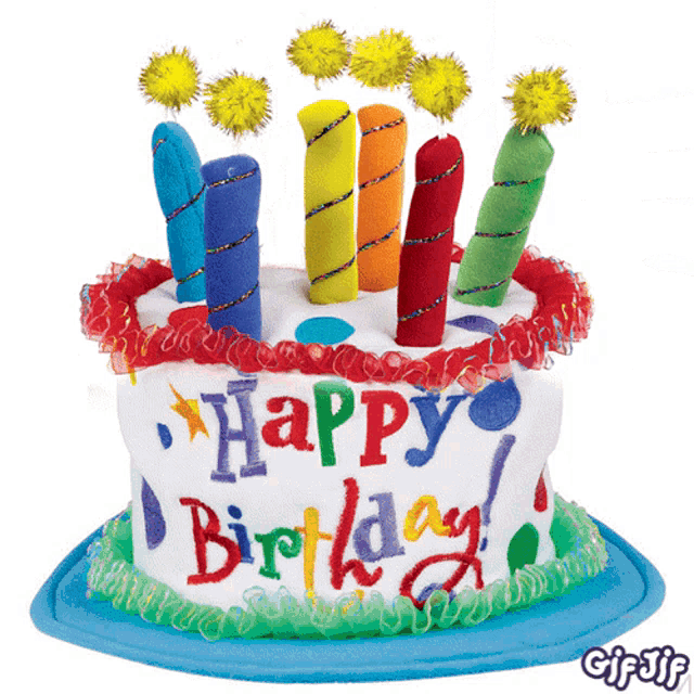 a birthday cake with candles and the words happy birthday written on it