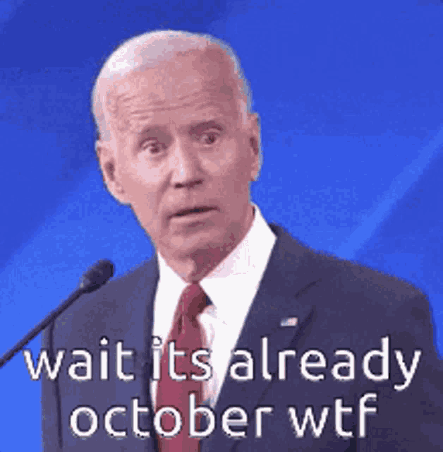 a man in a suit and tie says wait it 's already october