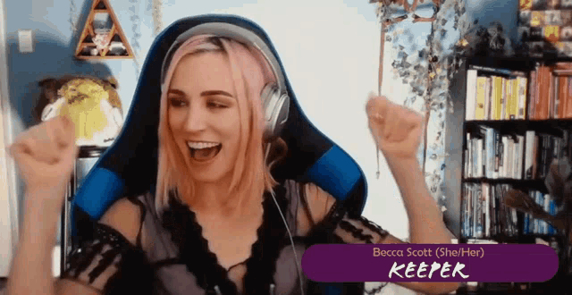 a woman with pink hair is wearing headphones and the name becca scott