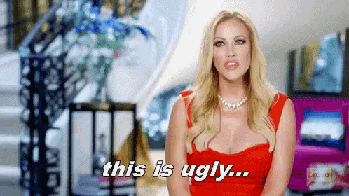 a woman in a red dress is saying that she is ugly .