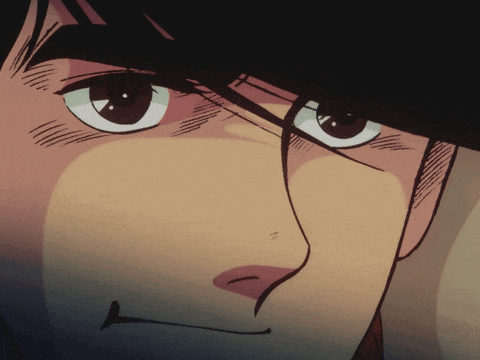 a close up of a man 's face with a slight smile on his face
