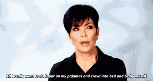a woman is talking about putting on her pajamas and crawling into bed and being by myself .