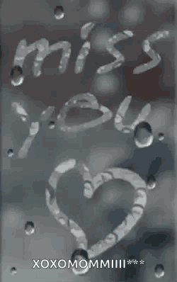 a drawing of a heart and the words `` miss you '' written on a window with water drops .