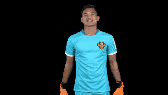 a soccer player wearing a blue shirt with a lion on the front