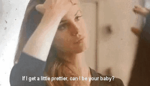a woman is applying makeup in front of a mirror and talking to herself .