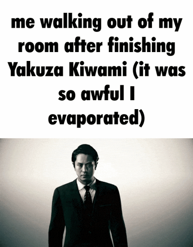 a man in a suit and tie is walking out of a room after finishing yakuza kiwami .