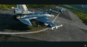 a fighter jet with the number 33-67 on the tail sits on a runway