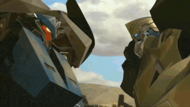 two robots are standing next to each other and looking at the camera