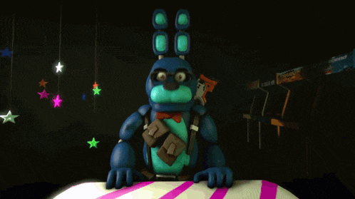 bonnie from five nights at freddy 's sits on a table