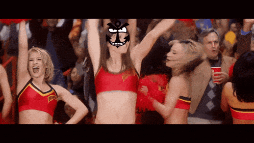 a cheerleader wearing a red top with the word hawks on it is cheering