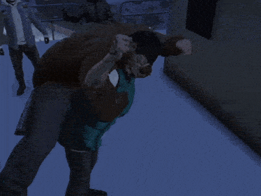 a man in a brown jacket is carrying a woman in a blue shirt