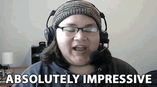 a woman wearing headphones and a hat says absolutely impressive
