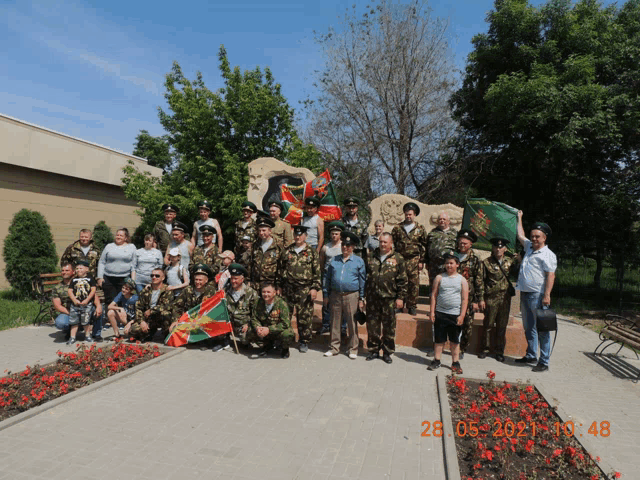 a group of soldiers are posing for a photo with a date of 28 05 2021