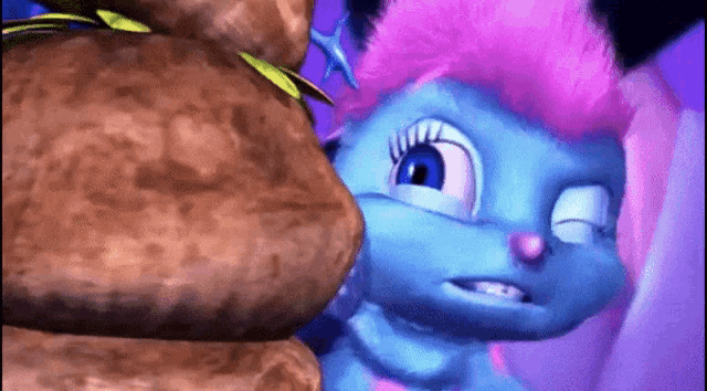 a blue cartoon character with pink hair is standing next to a rock