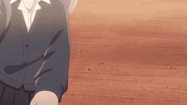 a girl in a school uniform is standing on a wooden surface