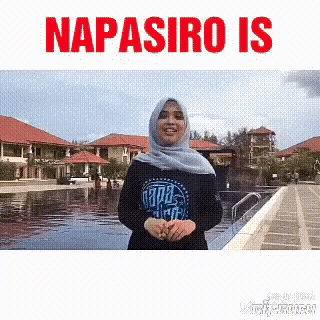 a woman wearing a hijab stands in front of a pool with the words napasiro is above her