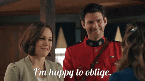a man in a red uniform says i 'm happy to oblige while standing next to a woman