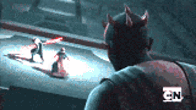 a man with horns on his head is standing in front of two people holding lightsabers in a dark room .