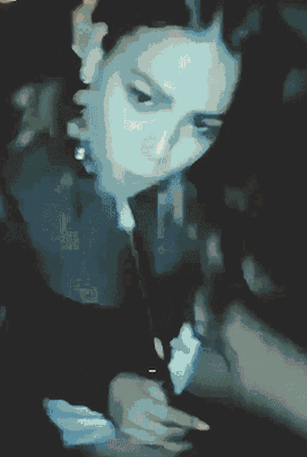 a blurry picture of a woman 's face with the word ' a ' on it