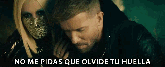 a man and a woman are standing next to each other with the words no me pidas que olvide tu huella written on the bottom