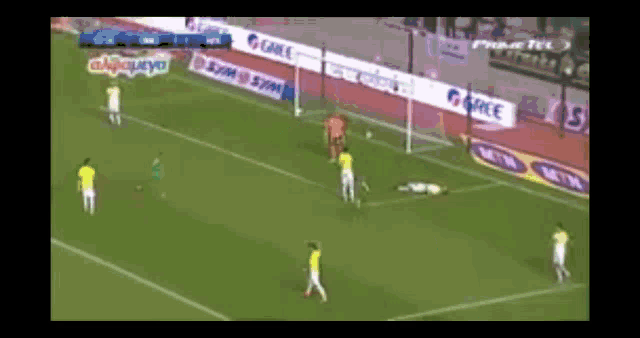 a soccer player wearing a green jersey that says gree
