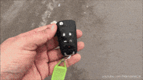 a yellow car is parked on the side of the road with a youtube.com link below it