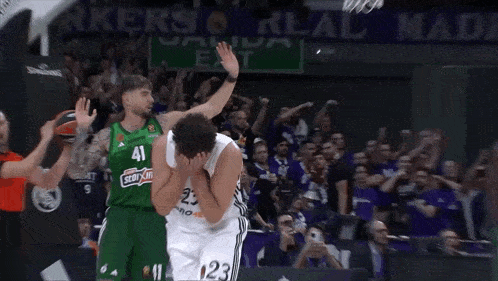 a basketball player wearing a green jersey with the number 41