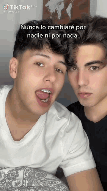 two young men are posing for a picture with a caption that says tik tok lite