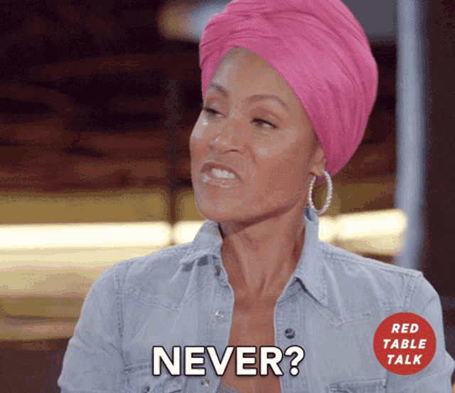 a woman wearing a pink turban is asking the question " never "