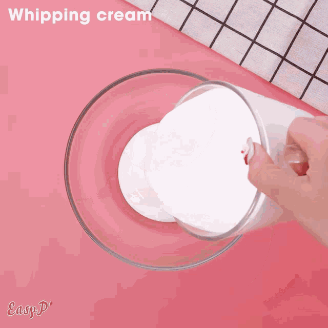 a person is pouring white liquid into a glass bowl with easyplus written on the bottom
