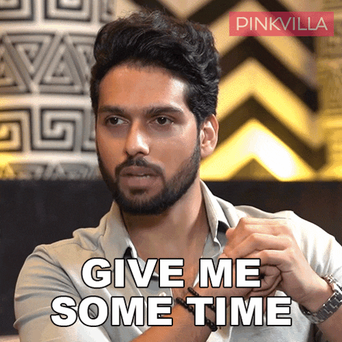 a man with a beard is asking for some time