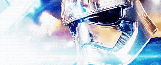a close up of a person wearing a helmet with a blue light coming out of it .