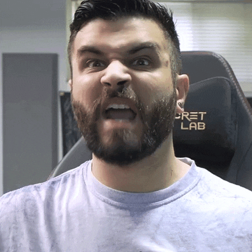 a man with a beard is wearing a shirt that says gret lab