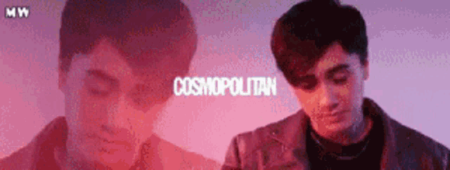 a man is standing in front of a pink background and the word cosmopolitan is on the bottom .