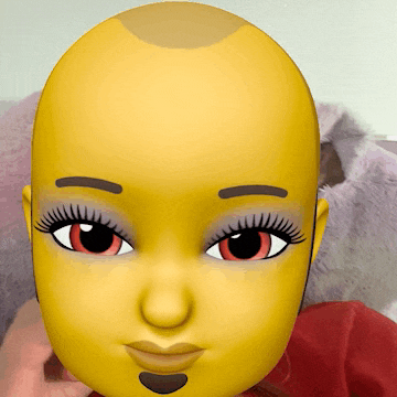 a yellow cartoon face with red eyes and a bald head