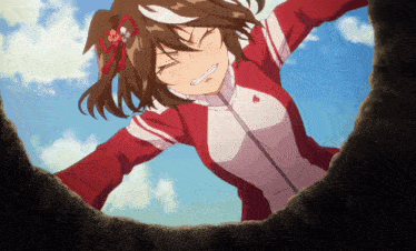 a girl wearing a red and white jacket with a red heart on the front