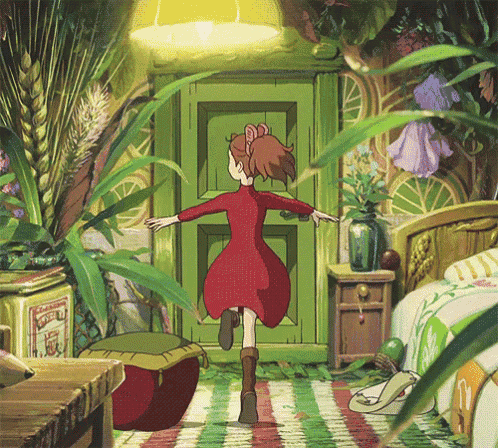 a girl in a red dress is running through a room