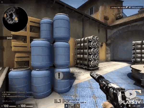a screenshot of a video game shows a stack of blue barrels
