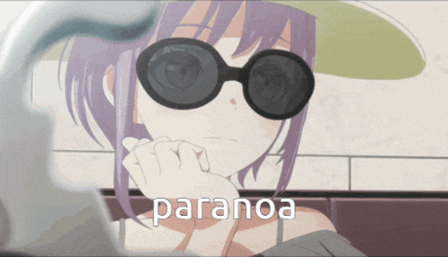 a girl wearing sunglasses and a hat with the word paranoa on it